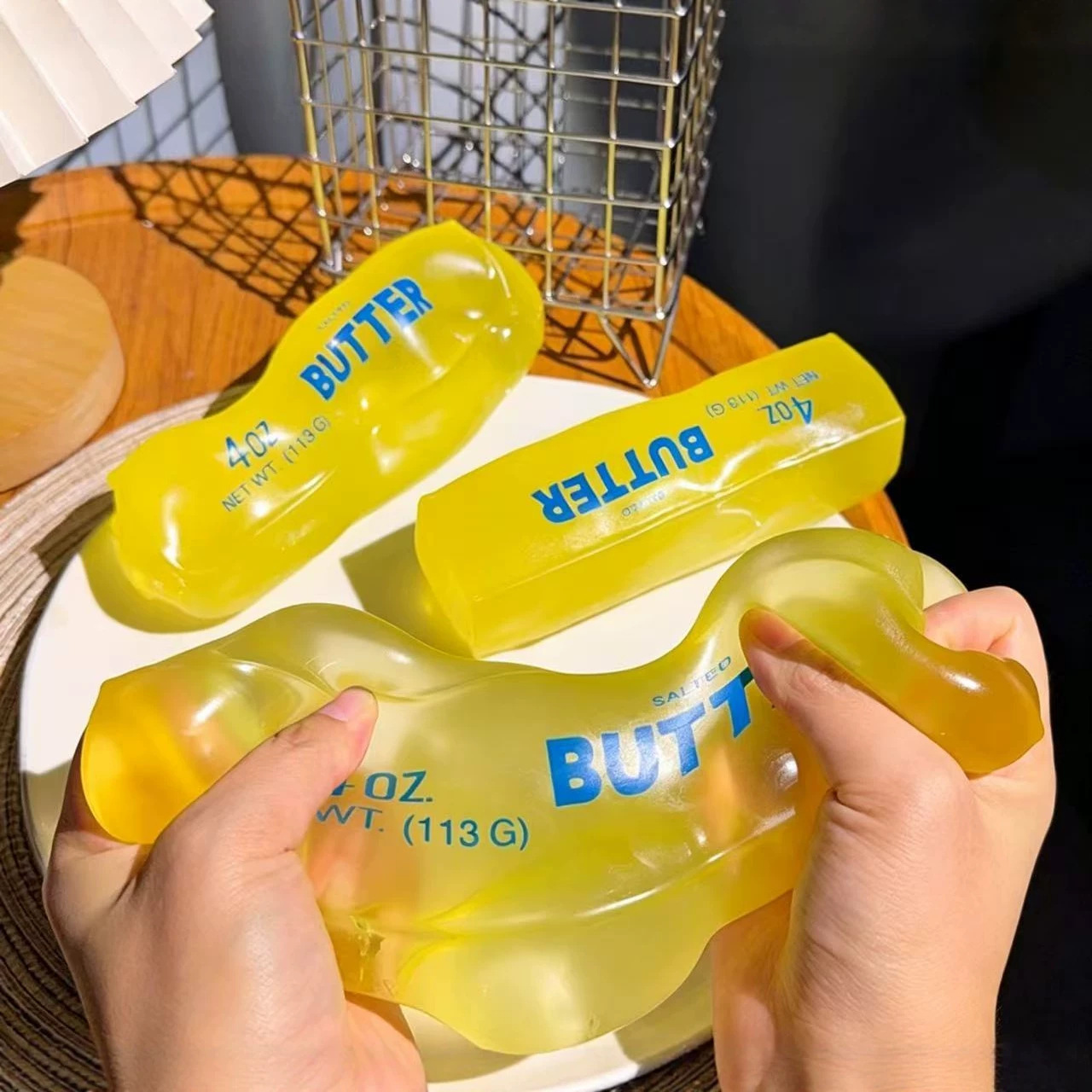 Soft, slow-rebound stress relief toys shaped like butter; soft stress relief toys shaped like sticks of butter; and soft stress balls—perfect as desk toys, party favors, and birthday gifts
