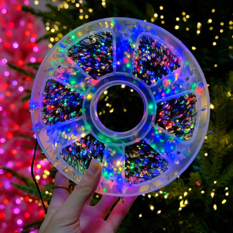 328-foot warm white LED Christmas light string with 1,000 bulbs, featuring invisible green wiring and multiple remote control modes. IP65 waterproof and cold-resistant, designed specifically for Christmas trees, gardens, and weddings.